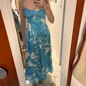 Madison Matthew’s Sally midi dress in blue tropical print
